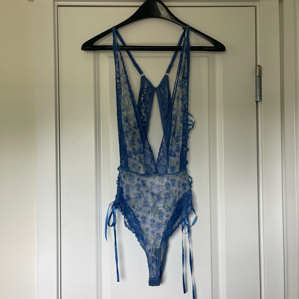 Blue sexy lace up bodysuit with a floral pattern